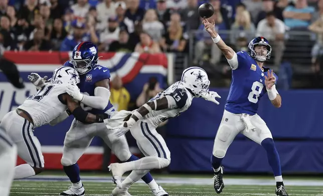 New York Giants quarterback Daniel Jones (8) passes against the Dallas Cowboys during the first half of an NFL football game, Thursday, Sept. 26, 2024, in East Rutherford, N.J. (AP Photo/Adam Hunger)