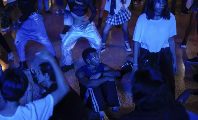 Youths dance to K-pop, popular Korean music, at a cultural house in Havana, Cuba, Saturday, Sept. 7, 2024. (AP Photo/Ramon Espinosa)