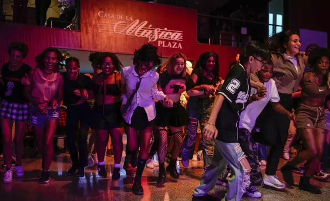 Youths dance to K-pop, popular Korean music, at a cultural house in Havana, Cuba, Saturday, Sept. 7, 2024. (AP Photo/Ramon Espinosa)