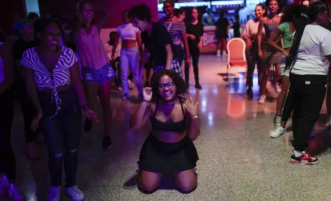 Youths dance to K-pop, popular Korean music, at a cultural house in Havana, Cuba, Saturday, Sept. 7, 2024. (AP Photo/Ramon Espinosa)