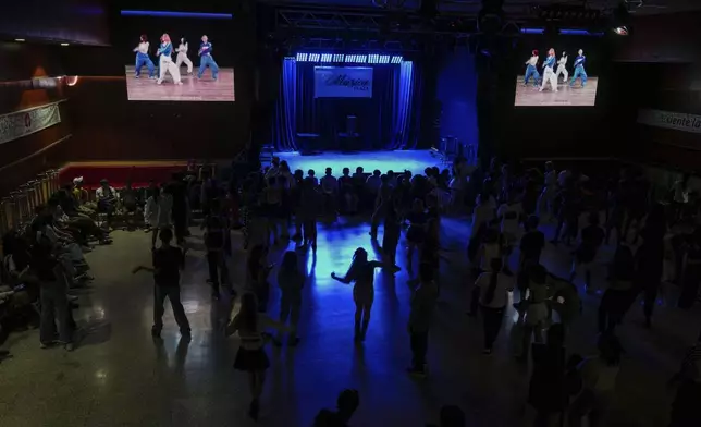 Youths dance to K-pop, popular Korean music, at a cultural house in Havana, Cuba, Saturday, Sept. 7, 2024. (AP Photo/Ramon Espinosa)