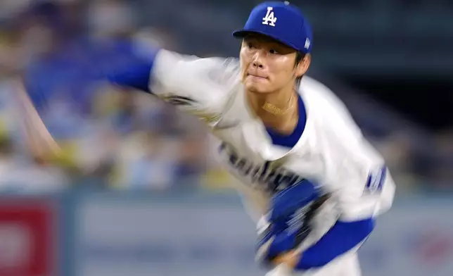 Los Angeles Dodgers starting pitcher Yoshinobu Yamamoto throws to the plate during the first inning of a baseball game against the Chicago Cubs, Tuesday, Sept. 10, 2024, in Los Angeles. (AP Photo/Mark J. Terrill)