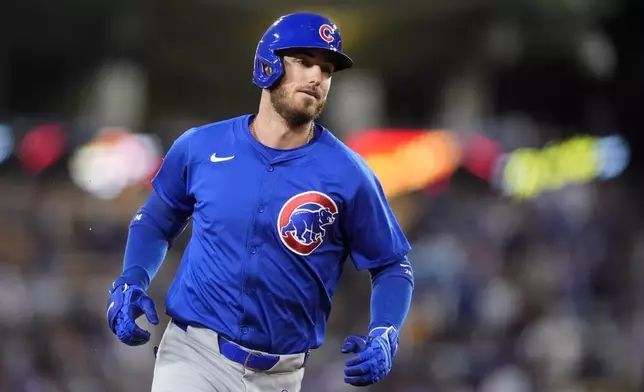 Chicago Cubs' Cody Bellinger rounds third after hitting a two-run home run during the first inning of a baseball game against the Los Angeles Dodgers, Monday, Sept. 9, 2024, in Los Angeles. (AP Photo/Mark J. Terrill)