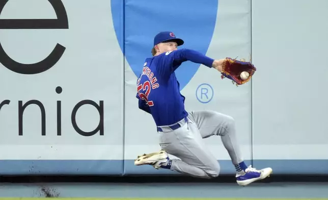 Chicago Cubs center fielder Pete Crow-Armstrong makes a catch on a ball hit by Los Angeles Dodgers' Kiké Hernández during the seventh inning of a baseball game, Tuesday, Sept. 10, 2024, in Los Angeles. (AP Photo/Mark J. Terrill)