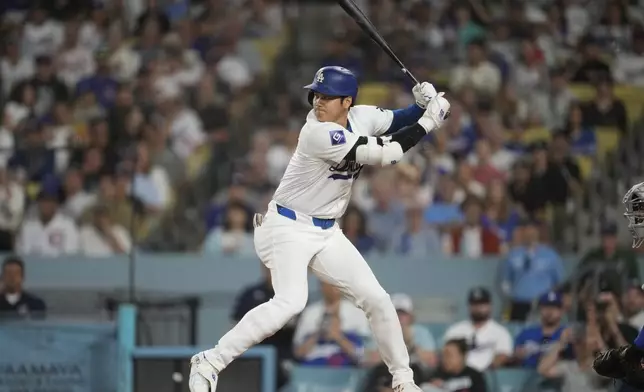 Los Angeles Dodgers designated hitter Shohei Ohtani (17) waits for a pitch during the first inning of a baseball game against the Chicago Cubs in Los Angeles, Wednesday, Sept. 11, 2024. (AP Photo/Ashley Landis)