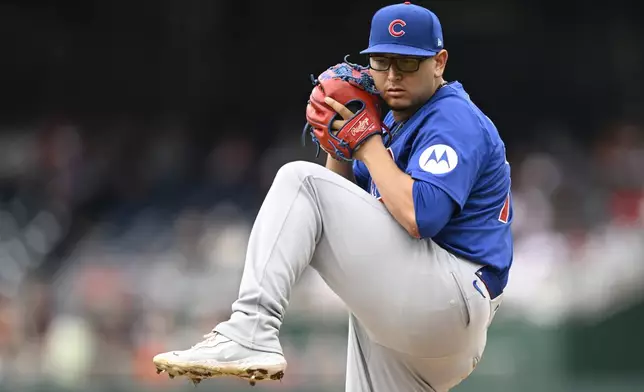 Chicago Cubs starting pitcher Javier Assad winds up during the second inning of a baseball game against the Washington Nationals, Saturday, Aug. 31, 2024, in Washington. (AP Photo/John McDonnell)