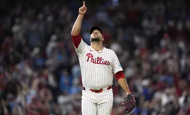 Philadelphia Phillies pitcher Carlos Estévez reacts after the Phillies won a baseball game against the Chicago Cubs, Wednesday, Sept. 25, 2024, in Philadelphia. (AP Photo/Matt Slocum)