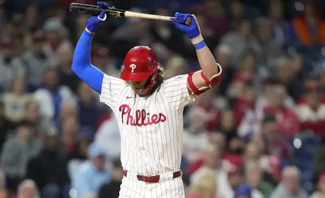 Philadelphia Phillies' Alec Bohm reacts after striking out against Chicago Cubs pitcher Hayden Wesneski during the eighth inning of a baseball game, Tuesday, Sept. 24, 2024, in Philadelphia. (AP Photo/Matt Slocum)