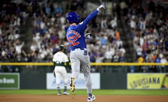 Chicago Cubs' Pete Crow-Armstrong celebrates while running the bases after hitting a home run in the seventh inning of a baseball game against the Colorado Rockies, Saturday, Sept. 14, 2024, in Denver. (AP Photo/Geneva Heffernan)