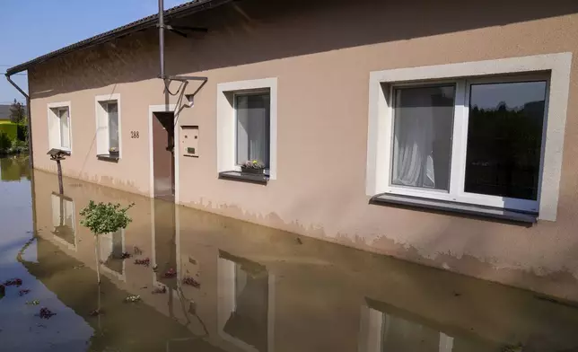 Zuzana Kublova's family home is flooded, in Bohumin, Czech Republic, Tuesday, Sept. 17, 2024. (AP Photo/Darko Bandic)