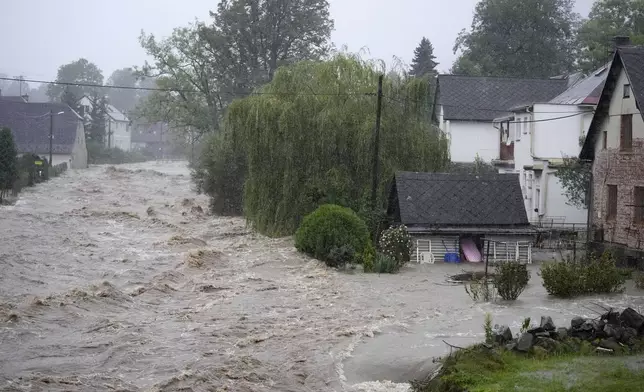 Flooded houses in Jesenik, Czech Republic, Sunday, Sept. 15, 2024. (AP Photo/Petr David Josek)