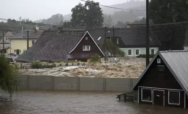 Flooded houses in Jesenik, Czech Republic, Sunday, Sept. 15, 2024. (AP Photo/Petr David Josek)