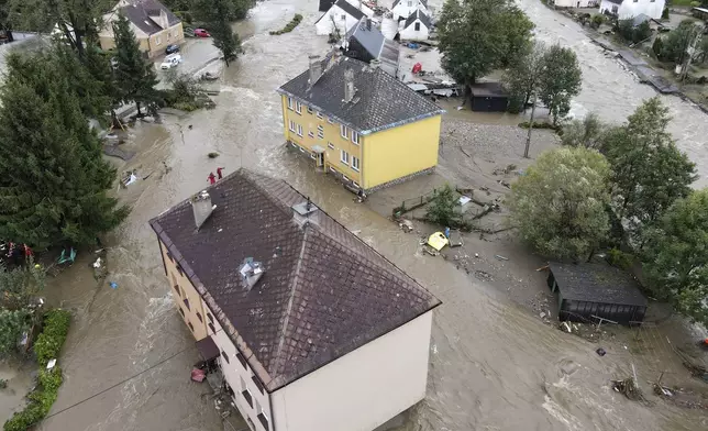 A view of flooded houses in Jesenik, Czech Republic, Sunday, Sept. 15, 2024. (AP Photo/Petr David Josek)