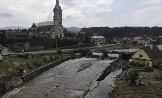 A view of a damaged village of Mikulovice as residents return to clean after recent floods in Czech Republic, Thursday, Sept. 19, 2024. (AP Photo/Petr David Josek)