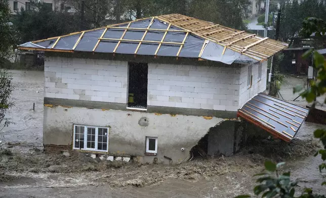 A flooded house in Jesenik, Czech Republic, Sunday, Sept. 15, 2024. (AP Photo/Petr David Josek)