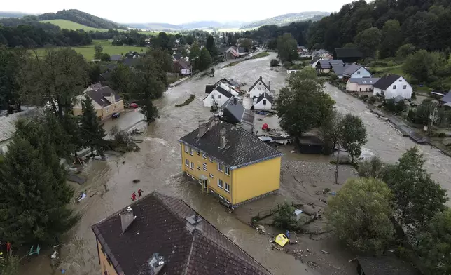 A view of flooded houses in Jesenik, Czech Republic, Sunday, Sept. 15, 2024. (AP Photo/Petr David Josek)