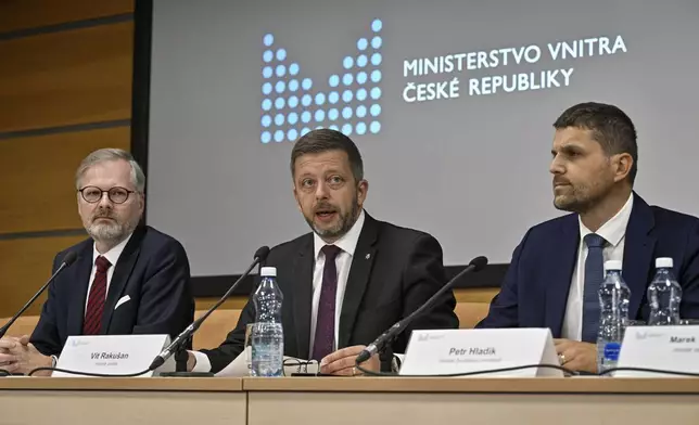 From left, Czech Prime Minister Petr Fiala, Czech Interior Minister Vit Rakusan and Czech Environment Minister Petr Hladik attend a news conference after the meeting of Central Crisis Staff due to the risk of floods in Prague, Czech Republic, Friday, Sept. 13, 2024. At right is Czech Interior Minister Vit Rakusan. (Vit Simanek/CTK via AP)