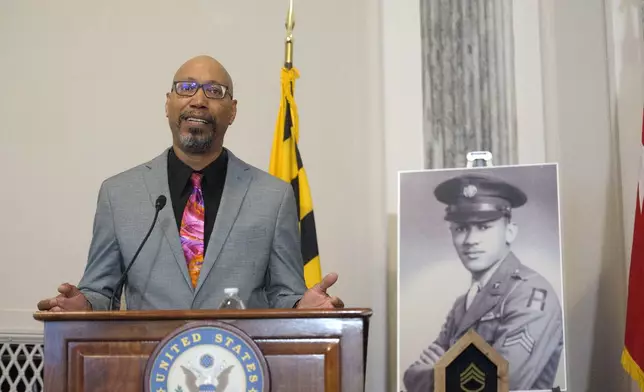 Steve Woodson offers remarks during a ceremony to posthumously award the Distinguished Service Cross to his father, U.S. Army Staff Sgt. Waverly Woodson Jr., a medic who was part of the only Black combat unit to take part in the D-Day invasion of France during World War II, on Capitol Hill, in Washington, Tuesday, Sept. 24, 2024. (AP Photo/Rod Lamkey, Jr.)