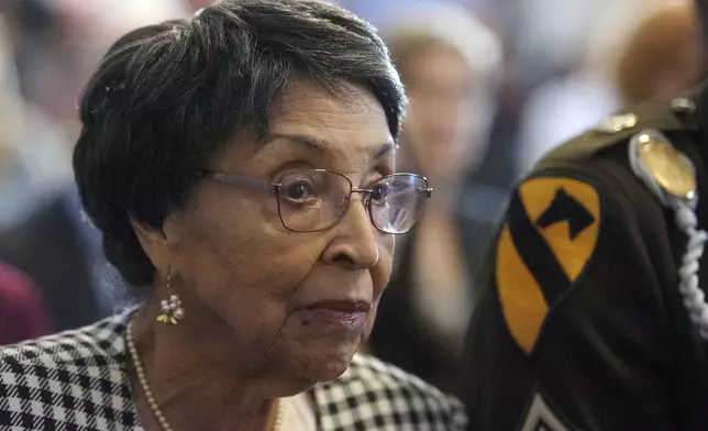 Joann Woodson listens to remarks during a ceremony to posthumously award the Distinguished Service Cross to her husband U.S. Army Staff Sgt. Waverly Woodson Jr., a medic who was part of the only Black combat unit to take part in the D-Day invasion of France during World War II, on Capitol Hill, in Washington, Tuesday, Sept. 24, 2024. (AP Photo/Rod Lamkey, Jr.)