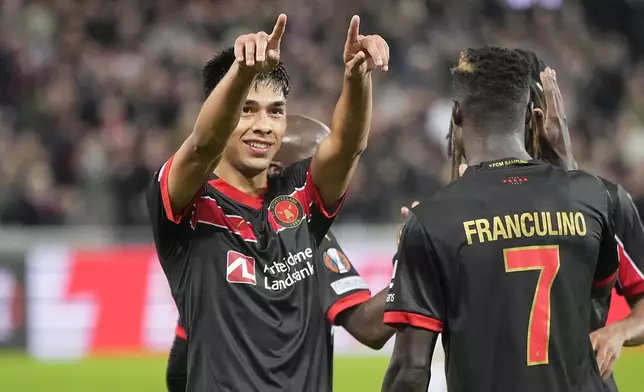 Midtjylland's Dario Osorio, left, celebrates after scoring the opening goal during the Europa League opening phase soccer match between FC Midtjylland and TSG 1899 Hoffenheim in Herning, Denmark, Wednesday, Sept. 25, 2024. (Bo Amstrup/Ritzau Scanpix via AP)