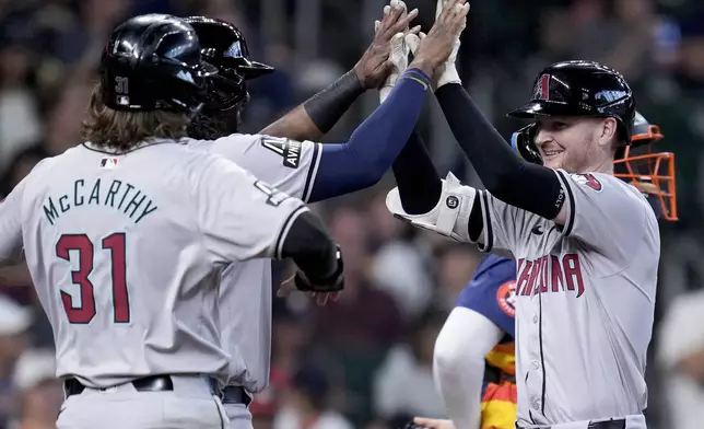 Arizona Diamondbacks' Pavin Smith, right, celebrates after his grand slam against the Houston Astros during the third inning of a baseball game Sunday, Sept. 8, 2024, in Houston. (AP Photo/Eric Christian Smith)