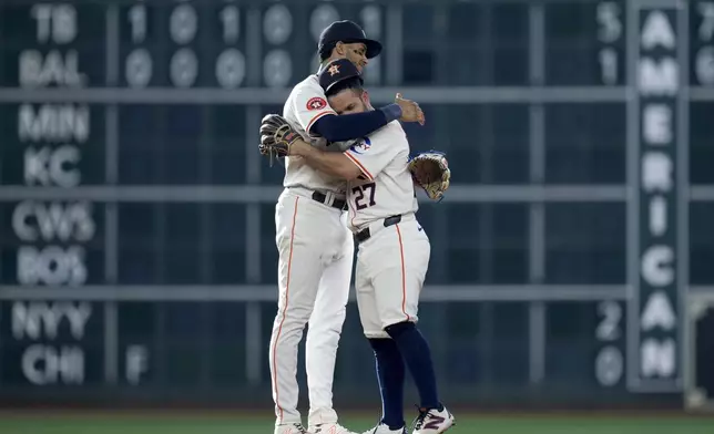 Houston Astros' Jose Altuve, right, and Jeremy Pena celebrate the team's win over the Arizona Diamondbacks in a baseball game, Saturday, Sept. 7, 2024, in Houston. (AP Photo/Eric Christian Smith)