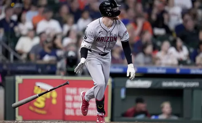 Arizona Diamondbacks' Pavin Smith watches his grand slam against the Houston Astros during the third inning of a baseball game Sunday, Sept. 8, 2024, in Houston. (AP Photo/Eric Christian Smith)