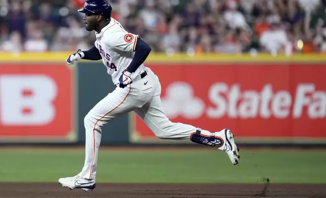 Houston Astros designated hitter Yordan Alvarez runs to second after hitting a double against the Arizona Diamondbacks during the first inning of a baseball game, Saturday, Sept. 7, 2024, in Houston. (AP Photo/Eric Christian Smith)