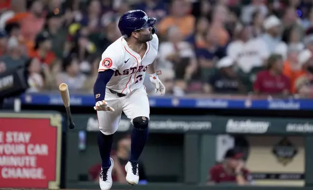 Houston Astros' Jose Altuve watches his solo home run against the Arizona Diamondbacks during the seventh inning of a baseball game Saturday, Sept. 7, 2024, in Houston. (AP Photo/Eric Christian Smith)