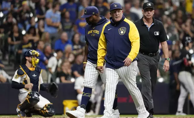 Milwaukee Brewers manager Pat Murphy, middle, reacts after being ejected during the fifth inning of a baseball game against the Arizona Diamondbacks, Saturday, Sept. 21, 2024, in Milwaukee. (AP Photo/Aaron Gash)