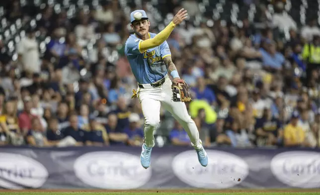 Milwaukee Brewers third base Joey Ortiz (3) throws out Arizona Diamondbacks' Gabriel Moreno during the seventh inning of a baseball game Friday, Sept. 20, 2024, in Milwaukee. (AP Photo/Jeffrey Phelps)