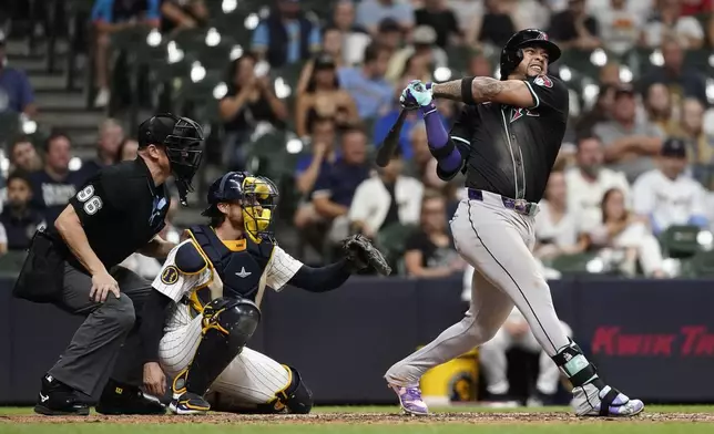 Arizona Diamondbacks' Ketel Marte hits a two-run home run during the ninth inning of a baseball game against the Milwaukee Brewers, Saturday, Sept. 21, 2024, in Milwaukee. (AP Photo/Aaron Gash)