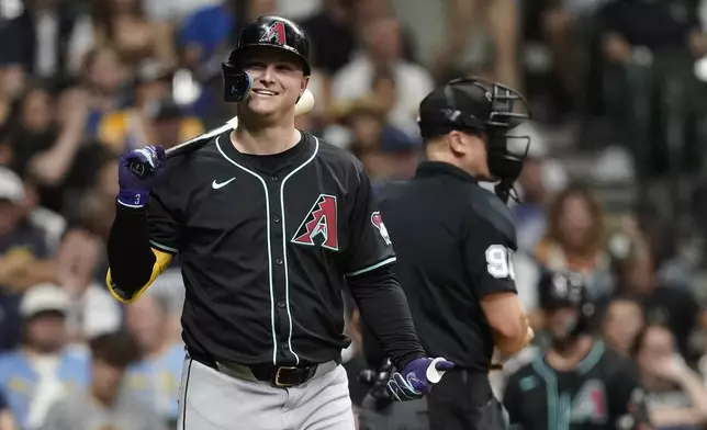 Arizona Diamondbacks' Joc Pederson smiles while at bat during the third inning of a baseball game against the Milwaukee Brewers, Saturday, Sept. 21, 2024, in Milwaukee. (AP Photo/Aaron Gash)