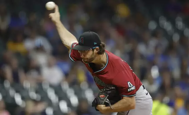 Arizona Diamondbacks pitcher Zac Gallen (23) throws during the first inning of a baseball game against the Milwaukee Brewers, Friday, Sept. 20, 2024, in Milwaukee. (AP Photo/Jeffrey Phelps)