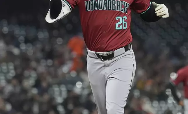 Arizona Diamondbacks' Pavin Smith gestures after hitting a home run against the San Francisco Giants during the fifth inning of a baseball game in San Francisco, Wednesday, Sept. 4, 2024. (AP Photo/Jeff Chiu)