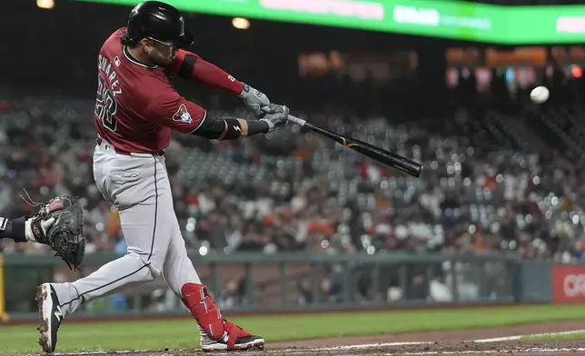 Arizona Diamondbacks' Eugenio Suárez hits a double against the San Francisco Giants during the eighth inning of a baseball game in San Francisco, Wednesday, Sept. 4, 2024. (AP Photo/Jeff Chiu)