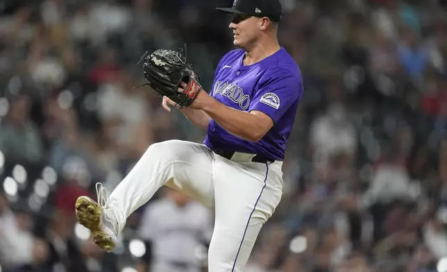 Colorado Rockies relief pitcher Seth Halvorsen works against the Arizona Diamondbacks in the ninth inning of a baseball game Monday, Sept. 16, 2024, in Denver. (AP Photo/David Zalubowski)