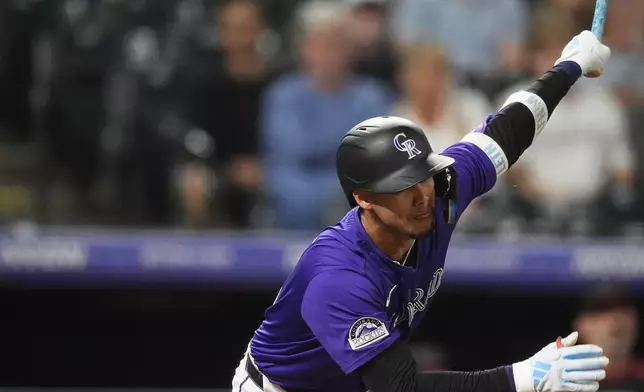 Colorado Rockies' Ezequiel Tovar singles off Arizona Diamondbacks starting pitcher Jordan Montgomery in the fifth inning of a baseball game ,Tuesday, Sept. 17, 2024, in Denver. (AP Photo/David Zalubowski)