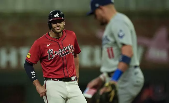 Atlanta Braves' Matt Olson (28) celebrates his RBI-double against the Los Angeles Dodgers inning of a baseball game, Friday, Sept. 13, 2024, in Atlanta. (AP Photo/Mike Stewart)