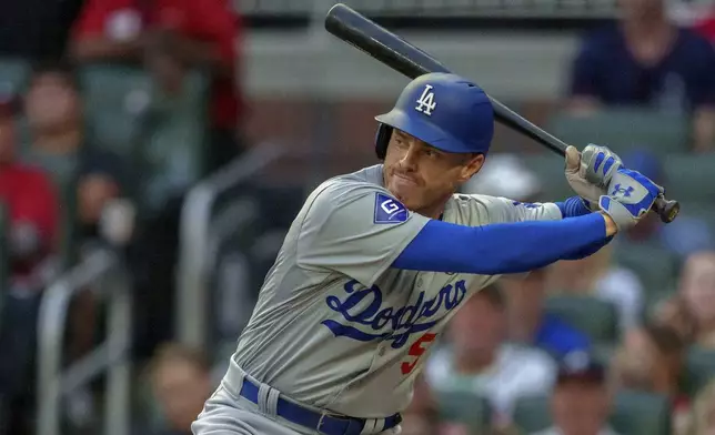 Los Angeles Dodgers' Freddie Freeman prepares to swing at the pitch in the first inning of a baseball game against the Atlanta Braves, Sunday, Sept. 15, 2024, in Atlanta. (AP Photo/Jason Allen)