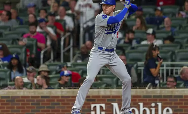 Los Angeles Dodgers' Freddie Freeman watches the pitch in the third inning of a baseball game against the Atlanta Braves, Saturday, Sept. 14, 2024, in Atlanta. (AP Photo/Jason Allen)