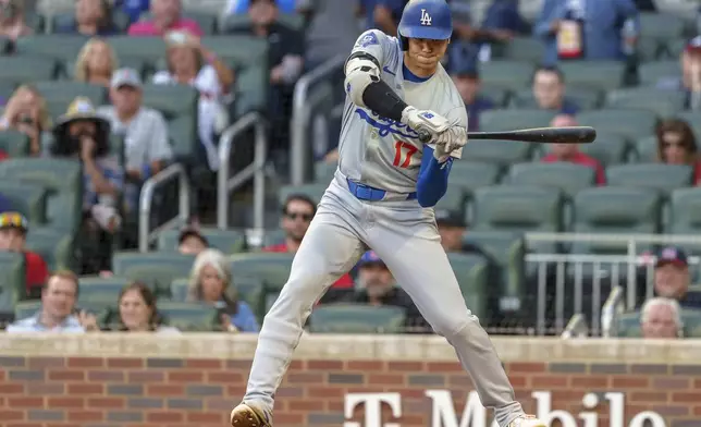 Los Angeles Dodgers' Shohei Ohtani watches a pitch go by called strike in the first inning of a baseball game against the Atlanta Braves, Monday, Sept. 16, 2024, in Atlanta. (AP Photo/Jason Allen)