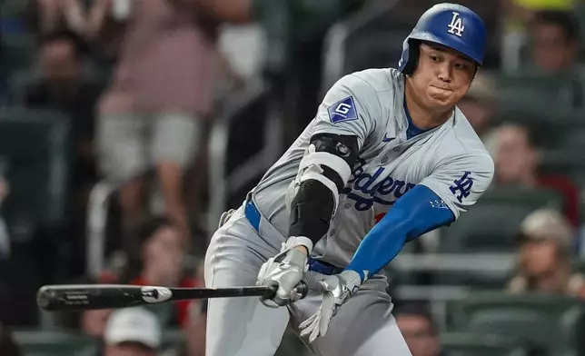 Los Angeles Dodgers two-way player Shohei Ohtani (17) stikes out in the third inning of a baseball game against the Atlanta Braves, Friday, Sept. 13, 2024, in Atlanta. (AP Photo/Mike Stewart)