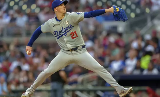 Los Angeles Dodgers pitcher Walker Buehler throws in the first inning of a baseball game against the Atlanta Braves, Sunday, Sept. 15, 2024, in Atlanta. (AP Photo/Jason Allen)