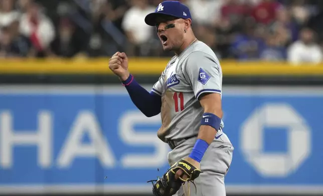 Los Angeles Dodgers shortstop Miguel Rojas reacts after tagging out Arizona Diamondbacks' Jake McCarthy in the sixth inning during a baseball game, Monday, Sept. 2, 2024, in Phoenix. (AP Photo/Rick Scuteri)