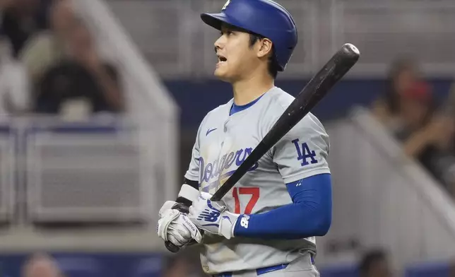 Los Angeles Dodgers' Shohei Ohtani (17) reacts after striking out during the fourth inning of a baseball game against the Miami Marlins, Wednesday, Sept. 18, 2024, in Miami. (AP Photo/Marta Lavandier)