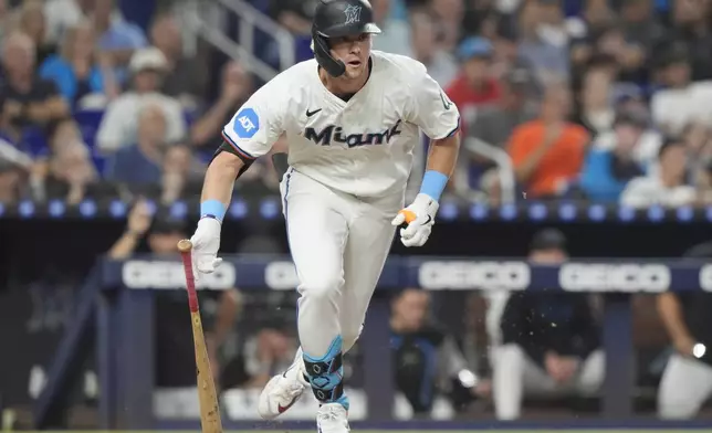 Miami Marlins' Kyle Stowers hits a triple to right field during the fourth inning of a baseball game against the Los Angeles Dodgers, Tuesday, Sept. 17, 2024, in Miami. (AP Photo/Marta Lavandier)