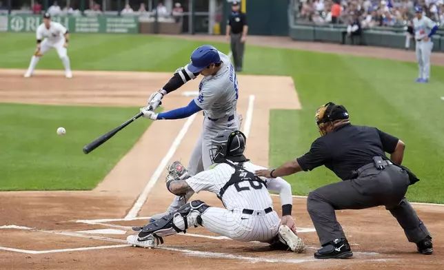 Los Angeles Dodgers' Shohei Ohtani hits a home run off Chicago White Sox starting pitcher Chris Flexen during the first inning of a baseball game Tuesday, June 25, 2024, in Chicago. (AP Photo/Charles Rex Arbogast)