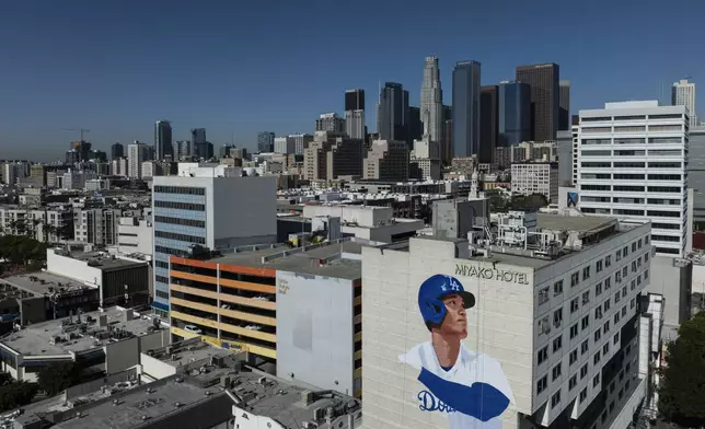 An aerial view shows a mural in progress of Los Angeles Dodgers' Shohei Ohtani, created by artist Robert Vargas, in the Little Tokyo neighborhood of Los Angeles Saturday, March 16, 2024. (AP Photo/Jae C. Hong)