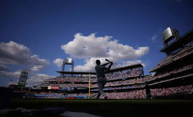 Los Angeles Dodgers' Shohei Ohtani prepares before a baseball game, Thursday, July 11, 2024, in Philadelphia. (AP Photo/Matt Slocum)